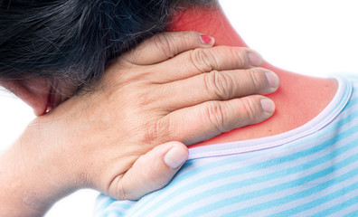 Senior woman her back touching neck(red area), as if suffering from chondrosis pain, standing over plain
