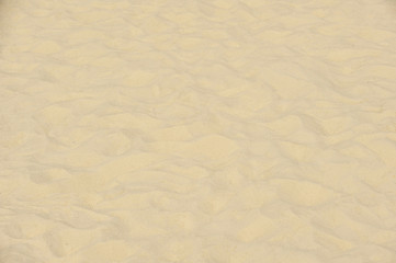 Sand Texture. Brown sand. Background from fine sand. Sand background