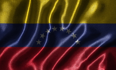 Fototapeta premium Wallpaper by Venezuela flag and waving flag by fabric.