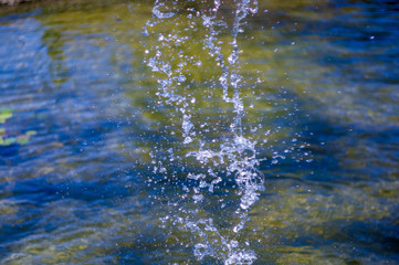 transparent falling water vertical flows, close up