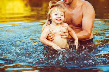 Fototapeta premium the father with the child in the water