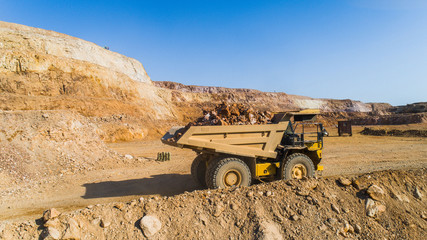 Dump truck Truck transports in the career of the ground © suvorovalex