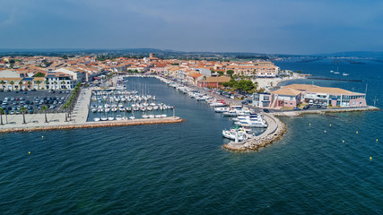 Obraz premium Aerial top view of boats and yachts in marina from above, harbor of Meze town, South France 