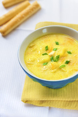 Cheese soup with chicken, potatoes and turmeric
