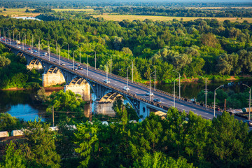 Panoramic view of bridge over river Klyazma in Vladimir city with railroad and green trees