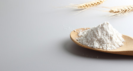 flour spoon spatula spikelets on a light background