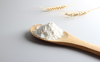 flour spoon spatula spikelets on a light background