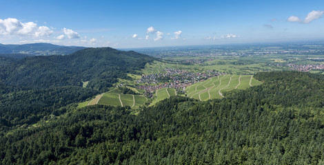 Fototapeta premium View over the Black Forest to the vineyards of the village Neuweier near Baden Baden, Germany