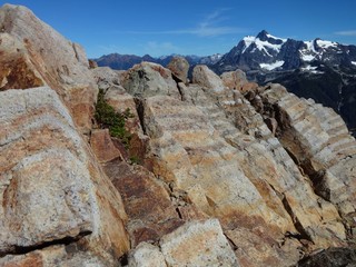 Volcanic rock formation with a view of Mount Shuksan in the North Cascades