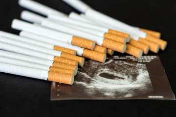 Cigarettes in the picture of pregnancy, pregnancy and smoking, cigarette
