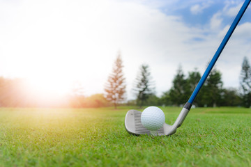 Golf concept : Golf ball on golf course, an 8 iron set up for fairway shot. With artificial sunlight and copy space.