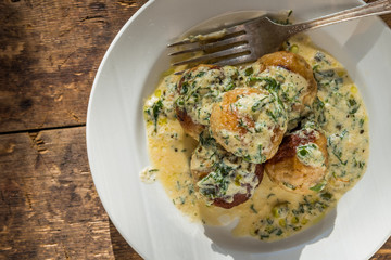 Swedish food - traditional chicken meatballs with cream sauce, top view, copy space