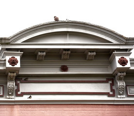 Birds resting on the detail work of an old building. © Joe