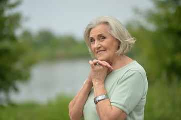 Fototapeta premium Portrait of a happy elderly woman posing
