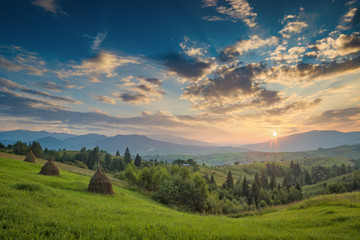 Fototapeta premium Majestic carpathian sunset in a summer mountain valley