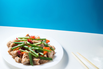 Kung pao chicken on white table