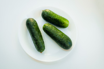 Cucumbers on a white plate