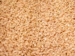 lot of brown rice texture, food background.