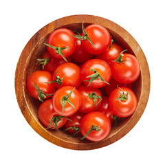 Fresh ripe tomatoes in wood bowl isolated on white background with green leaf. Ingredients for cooking. Top view.