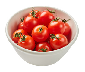 Fresh ripe tomatoes in ceramic bowl isolated on white background with green leaf. Ingredients for cooking. Top view.