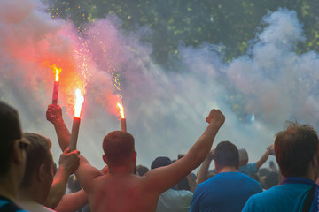 Football fans go to the stadium and burn the firecrackers