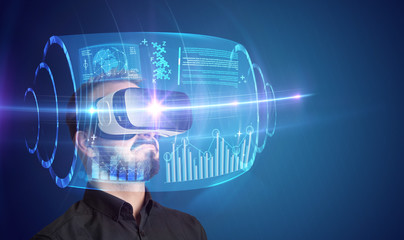 Amazed businessman with high tech 3D projection in front of him 