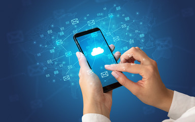 Female hand using smartphone with cloud, message and global concept
