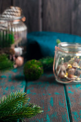 Christmas mood decoration. Rustic style Christmas. Spruce branches and wooden desk. Space for text.