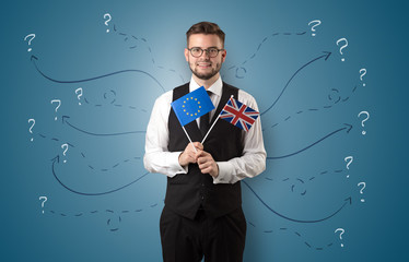 Smiling young man standing with flag and multidirectional arrows around

