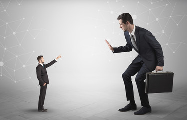 Small businessman aiming at a big businessman with connection and network concept
