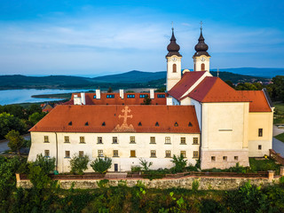 Tihany, Hungary - Aerial view of the famous Benedictine Monastery of Tihany (Tihany Abbey) at sunrise with Inner Lake (Belso-to) at background