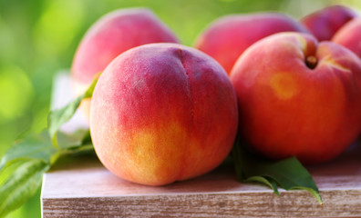 ripe peaches , closeup on white table