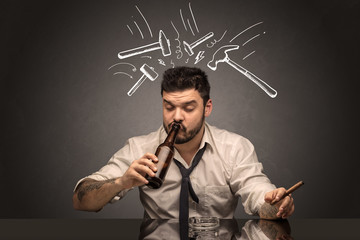 Young drunk disappointed man with hangover concept
