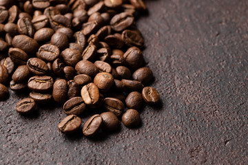 Close-up roasted coffee beans background. Top view with copy space