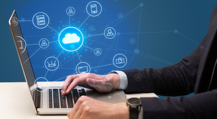 Businessman hand typing with cloud technology system and office symbol concept
