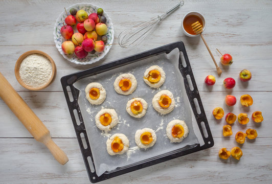 Sponge apple cake "Sharlotka" with baking ingredients, rustic style. Apple Ranet pie baking. 