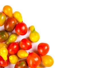 various colorful tomatoes isolated on white background
