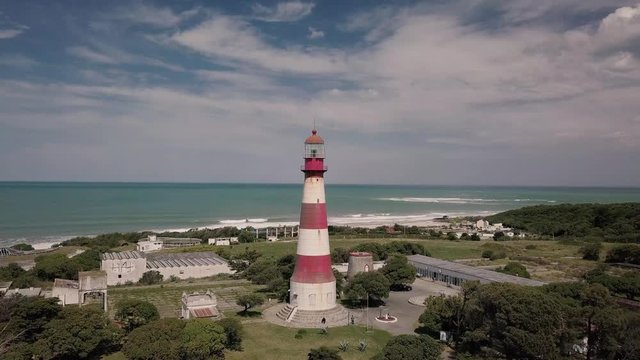 Mar del Plata Lighthouse Argentina – 4k drone video of the El Faro Lighthouse Argentinian coast near Acantilados and downtown area of Mar del Plata in spring.  Buenos Aires Capital Federal district  