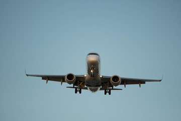 City Airport plane landing in the evening with tourists 
