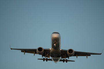 City Airport plane landing in the evening with tourists 