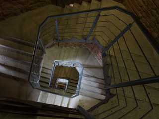 Modernist spiral staircase in recently built office block, showing clean lines and sophistication 