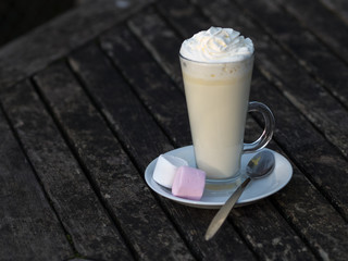 Cappuccino with Marshmallows on Rustic Wooden Table