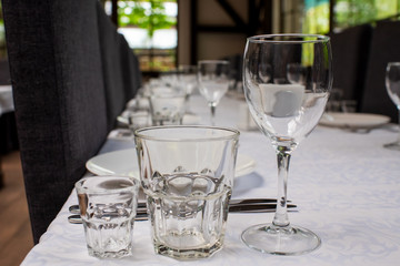 Glass goblets on the table in the restaurant in a serving