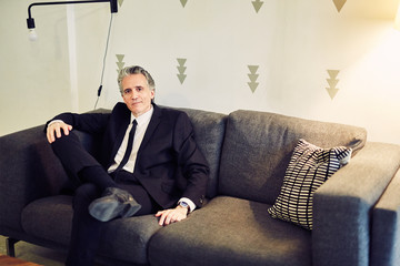 Grey Haired Caucasian Man Dressed in Contemporary Black Suit for Business, Executive