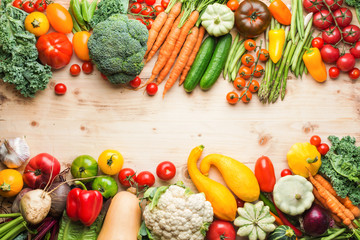 Fresh farm produce, organic vegetables on wooden pine table, healthy background, copy space for text, top view, selective focus
