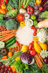 Fresh farm produce, colorful vegetables on wooden pine table, healthy background, copy space for text in the middle, top view, vertical, selective focus
