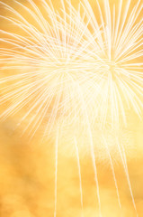 Golden abstract fireworks background.