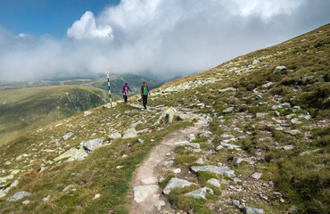 Naklejka premium Young couple of hikers