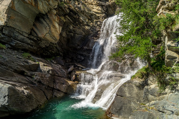 waterfall in the mountains among the rocks