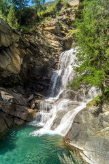 waterfall in the mountains among the rocks